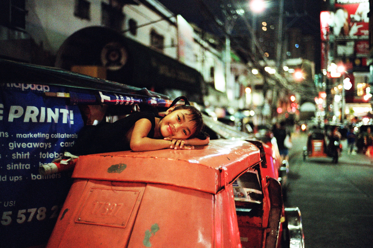 Girl on Top of a Tricycle