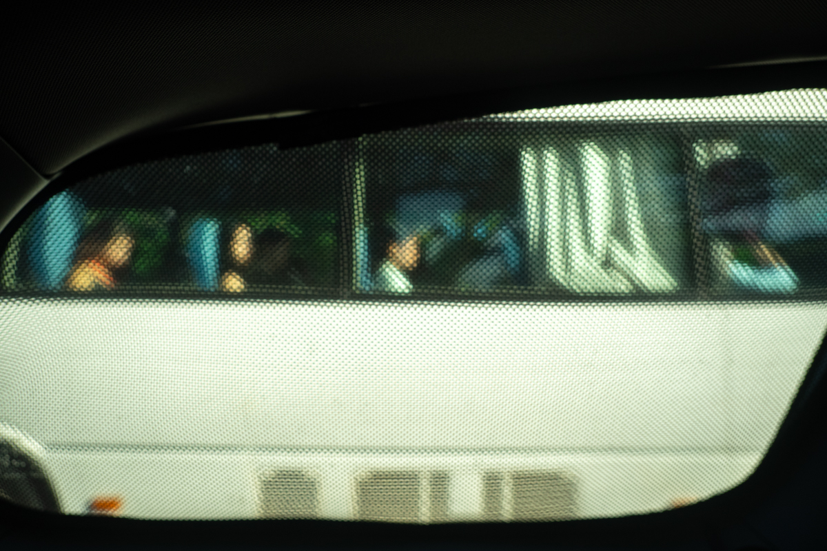 Bus in a taxi window frame