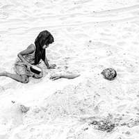 Girl and Mom Playing on Beach